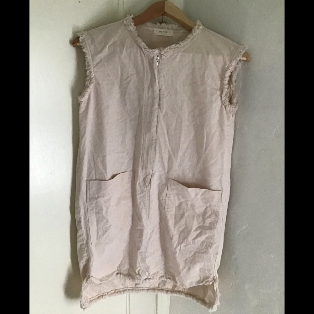 Denim material off white in color. Zipper down the front